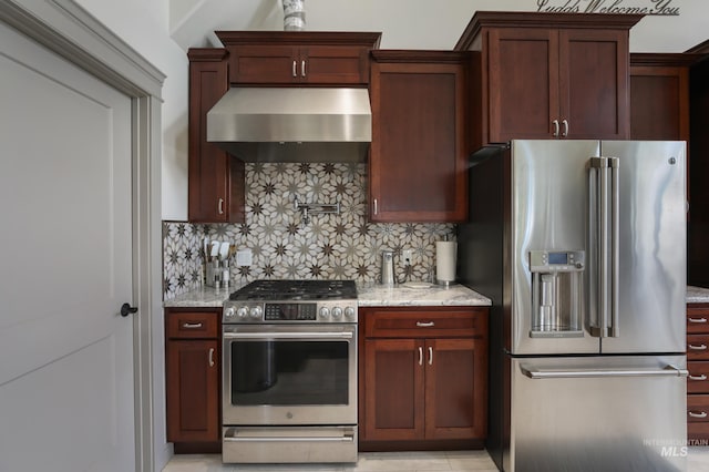 110 S 3rd Ave, Pierce, ID 83546 - kitchen featuring appliances with stainless steel finishes, wall chimney exhaust hood, decorative backsplash, and light stone counters