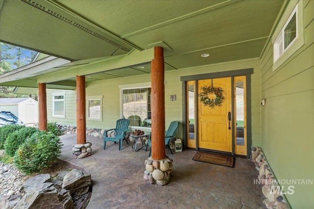 doorway to property with a porch