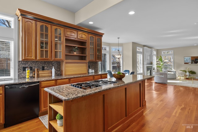 kitchen with tasteful backsplash, stainless steel gas cooktop, dishwasher, light wood-type flooring, and open shelves