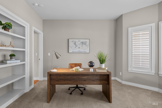 carpeted office with baseboards