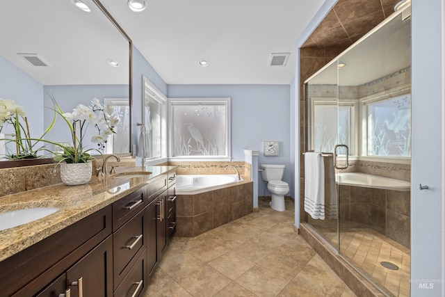 full bath with a sink, visible vents, a garden tub, and a shower stall