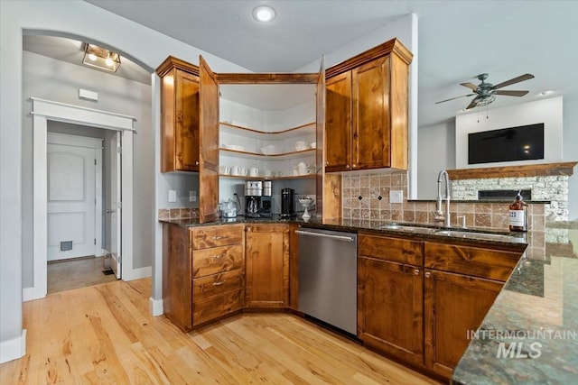 12231 W Caribee Inlet Dr, Star, ID 83669 - kitchen with stainless steel dishwasher, light wood-type flooring, dark stone counters, ceiling fan, and recessed lighting