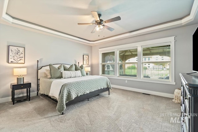 12231 W Caribee Inlet Dr, Star, ID 83669 - carpeted bedroom featuring a raised ceiling and ceiling fan