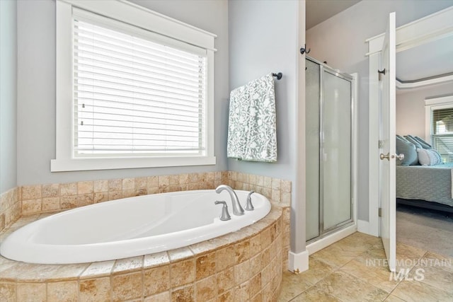 12231 W Caribee Inlet Dr, Star, ID 83669 - full bathroom with connected bathroom, a shower stall, and a garden tub
