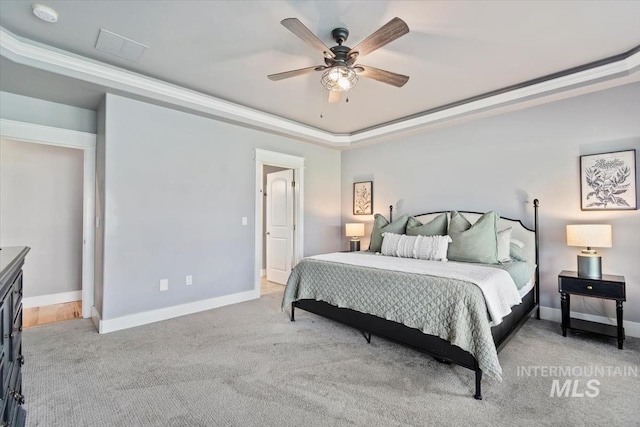 12231 W Caribee Inlet Dr, Star, ID 83669 - bedroom featuring a tray ceiling, light carpet, a ceiling fan, and crown molding