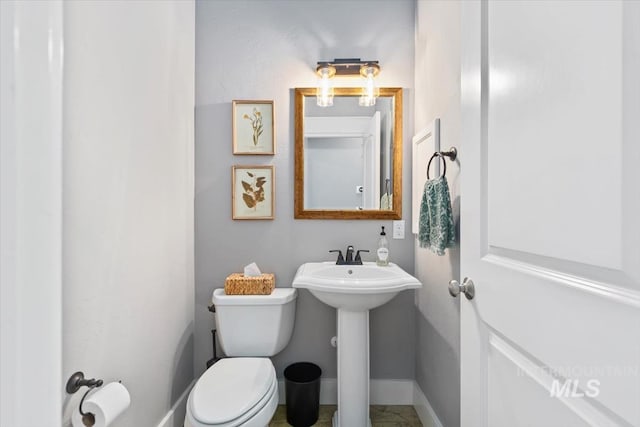 12231 W Caribee Inlet Dr, Star, ID 83669 - bathroom featuring toilet and baseboards