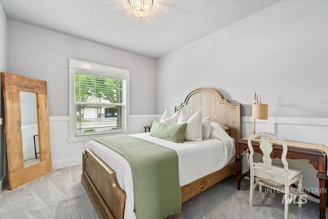 12231 W Caribee Inlet Dr, Star, ID 83669 - bedroom with light colored carpet, a textured ceiling, and wainscoting