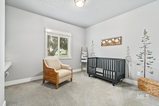 12231 W Caribee Inlet Dr, Star, ID 83669 - bedroom with carpet floors, a crib, and a textured ceiling