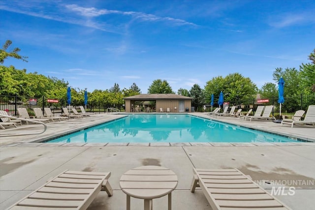 12231 W Caribee Inlet Dr, Star, ID 83669 - community pool featuring a patio