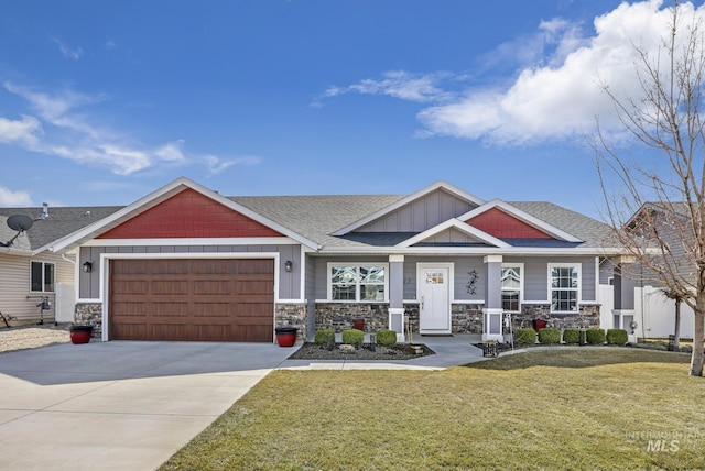 craftsman house featuring driveway, a front lawn, stone siding, board and batten siding, and a garage