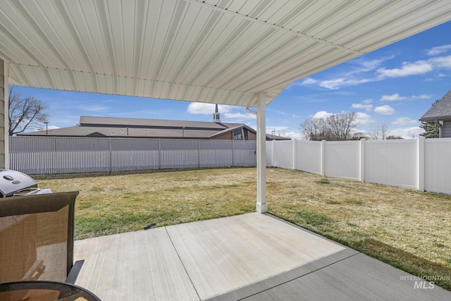 view of yard featuring a patio area and a fenced backyard