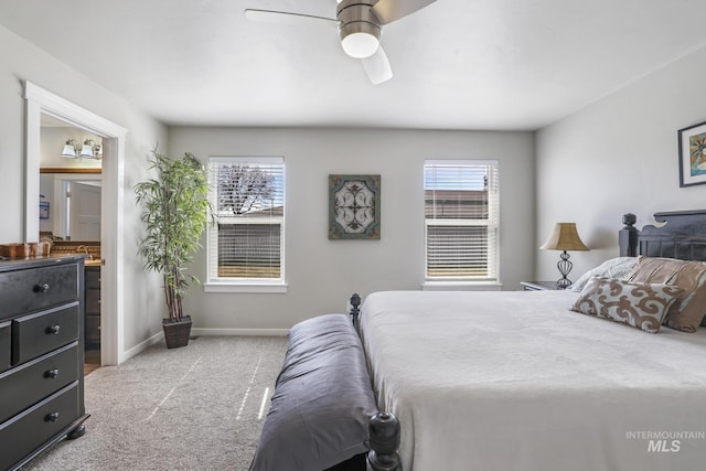 bedroom with multiple windows, baseboards, connected bathroom, and carpet floors