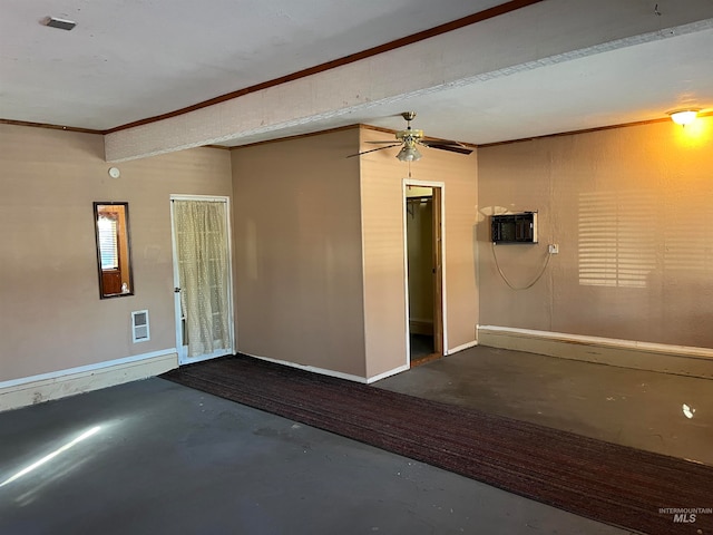 spare room featuring a wall unit AC, crown molding, and ceiling fan