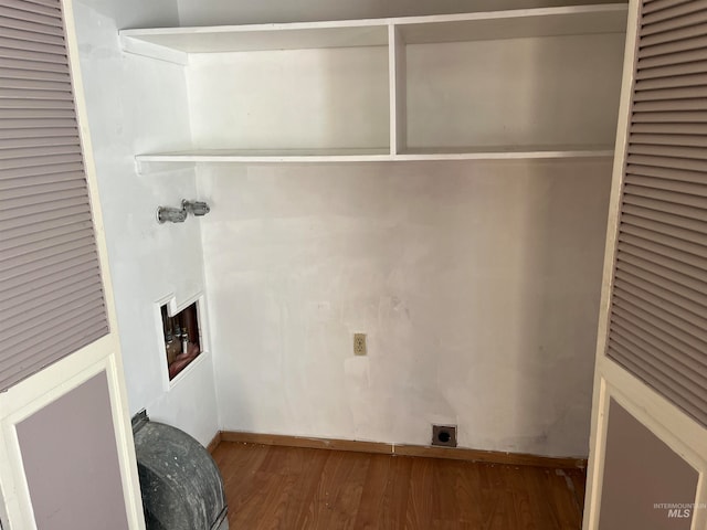 laundry area with hardwood / wood-style floors, washer hookup, and electric dryer hookup