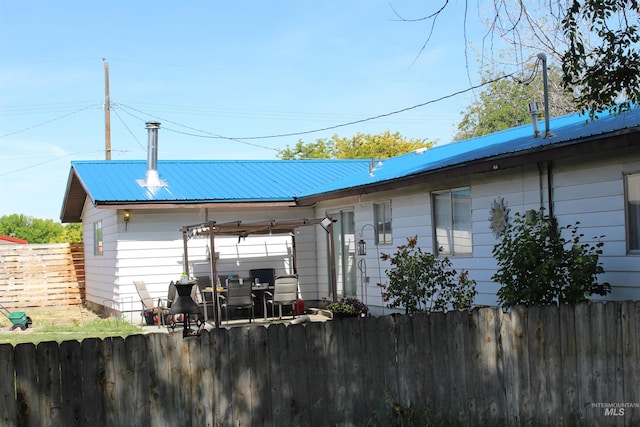 rear view of house featuring a patio area