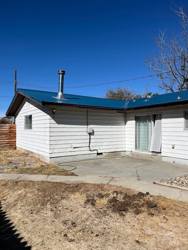 rear view of house with a patio