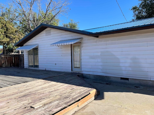 exterior space featuring a wooden deck