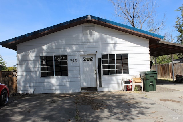 view of front of home with a carport