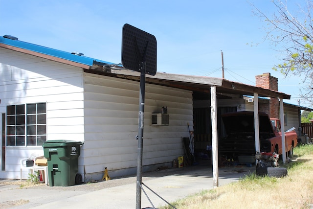 rear view of property with a carport