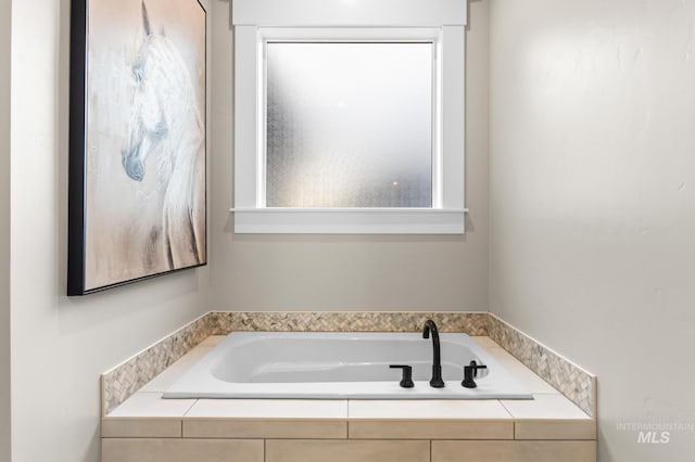 bathroom with a garden tub