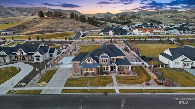 birds eye view of property with a residential view and a mountain view