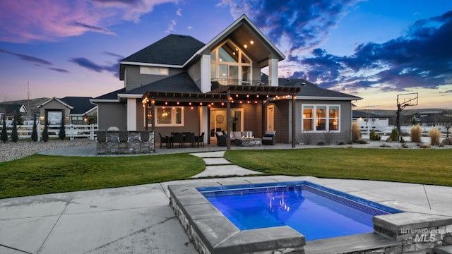 back of house featuring fence, an outdoor hangout area, a yard, a pergola, and a patio