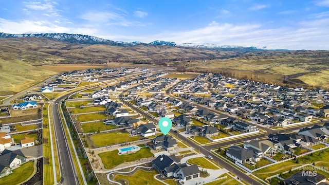 aerial view featuring a mountain view and a residential view