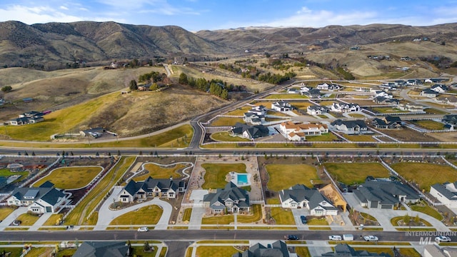 birds eye view of property with a residential view and a mountain view