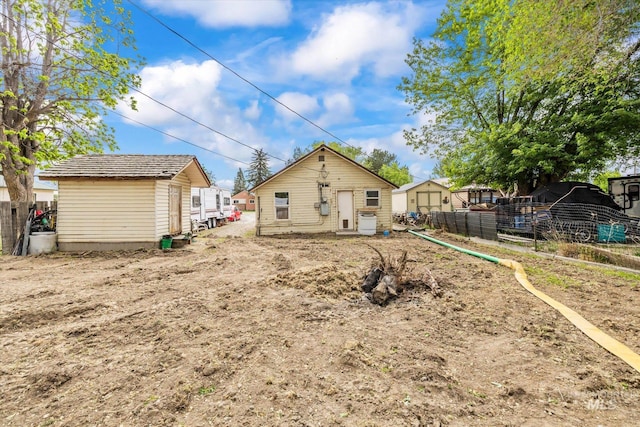 328 W Owyhee Ave, Homedale, ID 83628 - rear view of property with fence, an outbuilding, and a shed