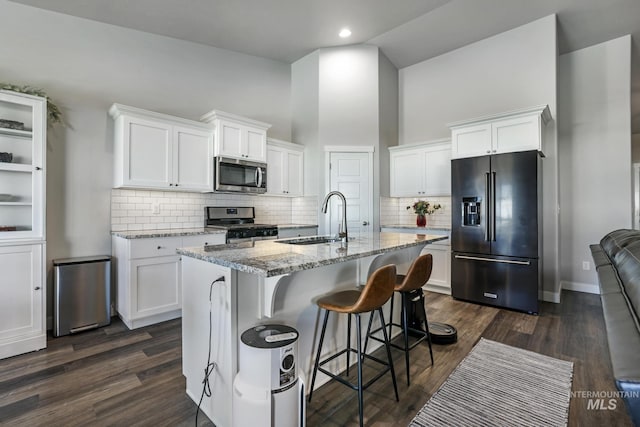 kitchen featuring a sink, white cabinetry, and stainless steel appliances