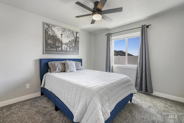 carpeted bedroom featuring baseboards and ceiling fan