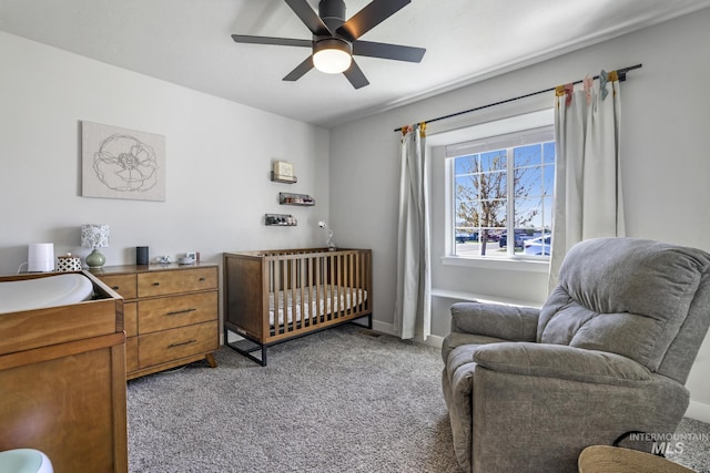 bedroom with ceiling fan, light carpet, and baseboards