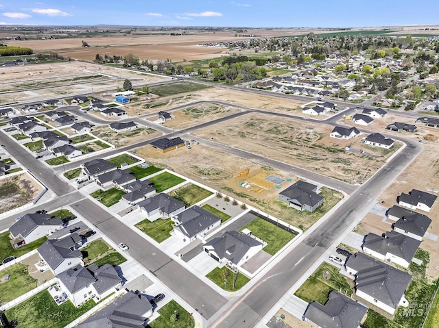 birds eye view of property with a residential view