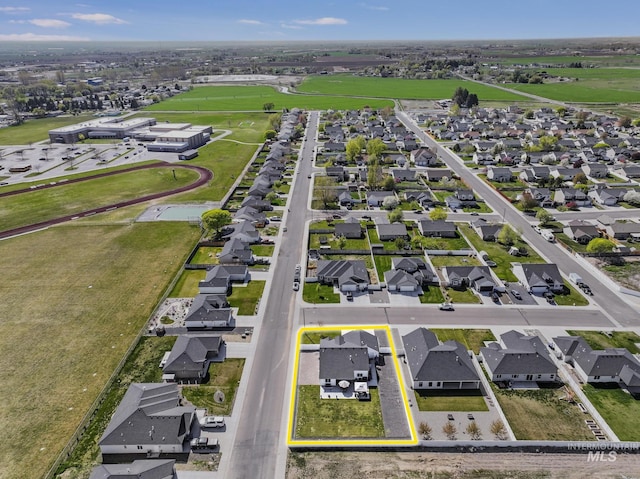 birds eye view of property with a residential view