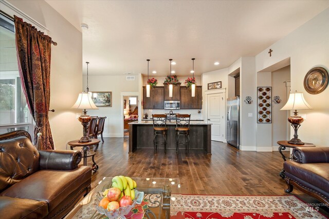 11771 W Cross Slope Way, Nampa, ID 83686 - living area featuring dark wood-style flooring, visible vents, recessed lighting, and baseboards