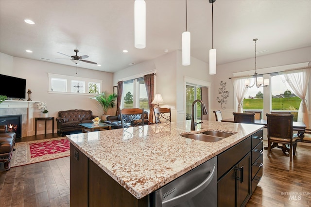 11771 W Cross Slope Way, Nampa, ID 83686 - kitchen with stainless steel dishwasher, a sink, dark wood-style floors, open floor plan, and a ceiling fan