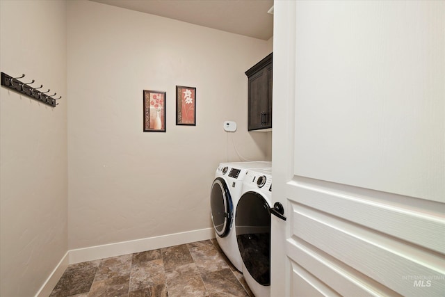 11771 W Cross Slope Way, Nampa, ID 83686 - clothes washing area with washing machine and dryer, cabinet space, stone finish flooring, and baseboards