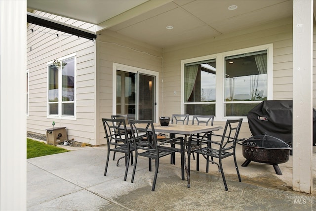 11771 W Cross Slope Way, Nampa, ID 83686 - view of patio / terrace with outdoor dining space, a grill, and an outdoor fire pit