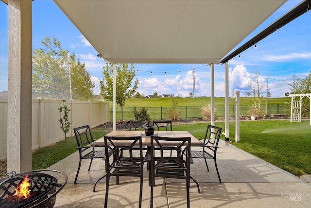 11771 W Cross Slope Way, Nampa, ID 83686 - view of patio featuring a fenced backyard, an outdoor fire pit, and outdoor dining area
