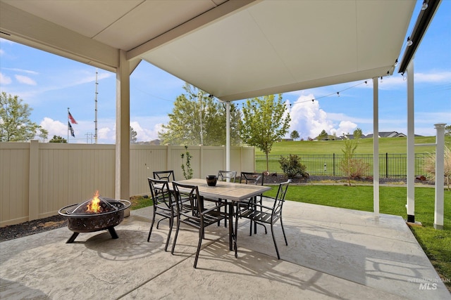 11771 W Cross Slope Way, Nampa, ID 83686 - view of patio with a fire pit, a fenced backyard, and outdoor dining area
