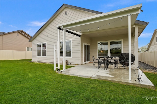11771 W Cross Slope Way, Nampa, ID 83686 - rear view of property featuring a yard, a patio, and a fenced backyard
