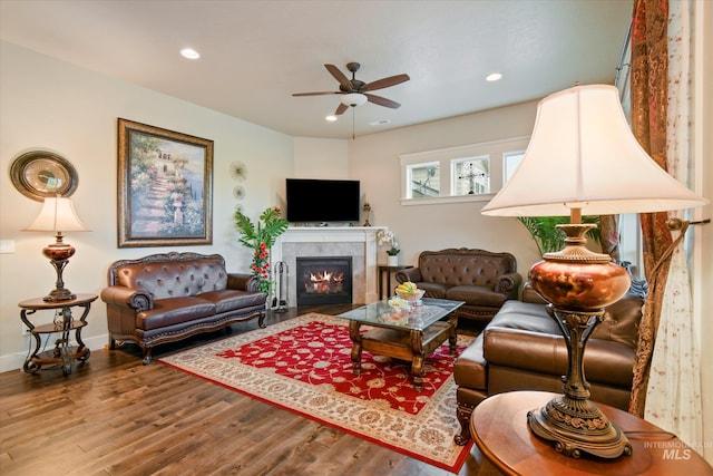 11771 W Cross Slope Way, Nampa, ID 83686 - living area with recessed lighting, wood finished floors, a ceiling fan, and a tile fireplace