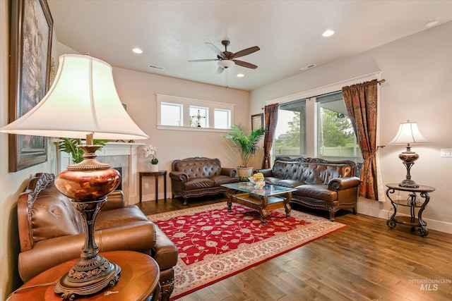 11771 W Cross Slope Way, Nampa, ID 83686 - living area featuring wood finished floors, ceiling fan, plenty of natural light, and visible vents