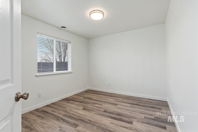 178 W Lava Falls Dr, Meridian, ID 83646 - empty room featuring wood finished floors and baseboards