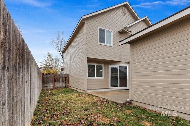 178 W Lava Falls Dr, Meridian, ID 83646 - rear view of house with a patio area and a fenced backyard
