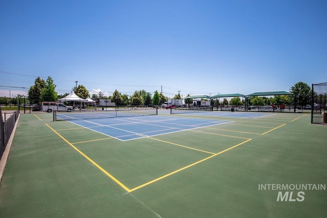 view of tennis court featuring a gazebo