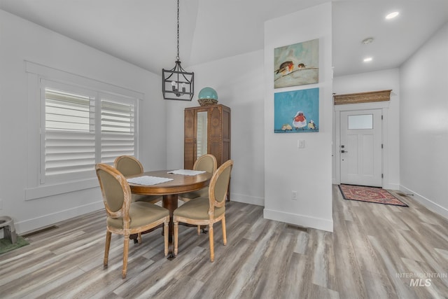 dining area with light wood-style floors, baseboards, and recessed lighting