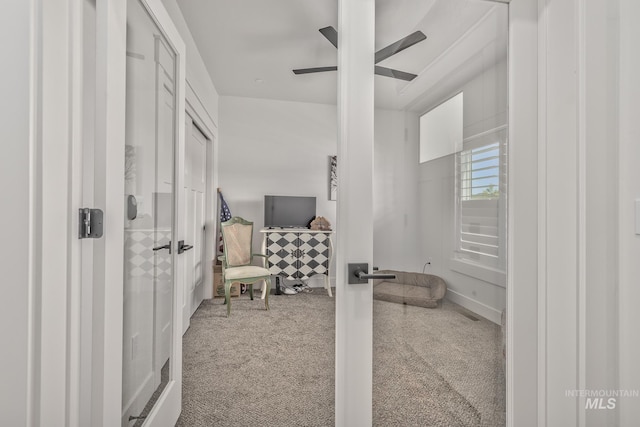 interior space with a ceiling fan