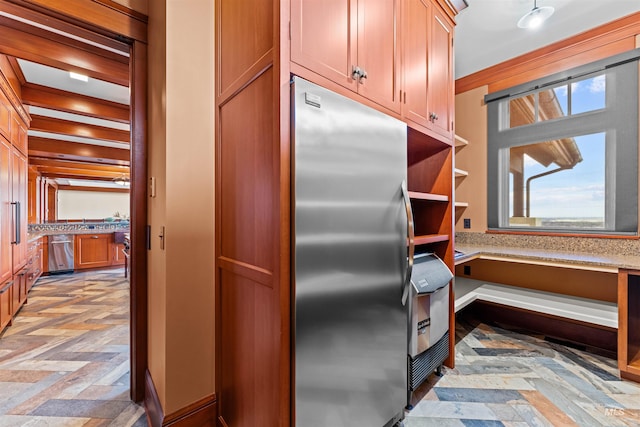 kitchen featuring built in desk, stainless steel appliances, and light parquet flooring