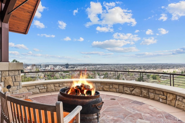 balcony featuring an outdoor fire pit